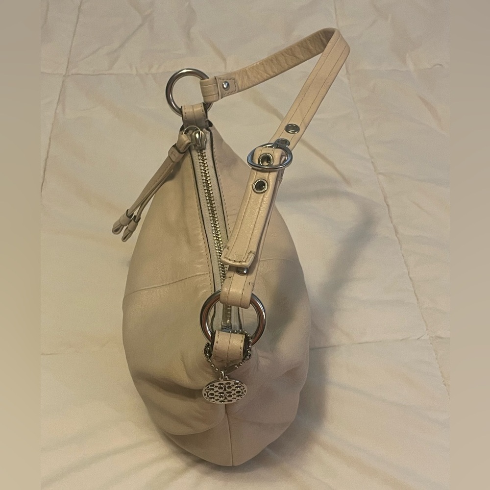 Cream Coach bag with rare OP Art silver nickel metal bag charm hang tag.